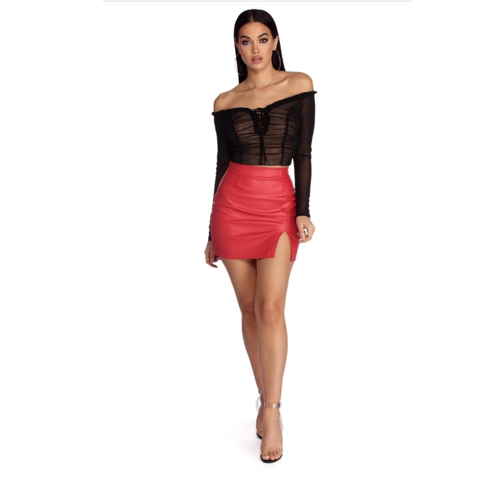 Red high rise waist, faux leather skirt.